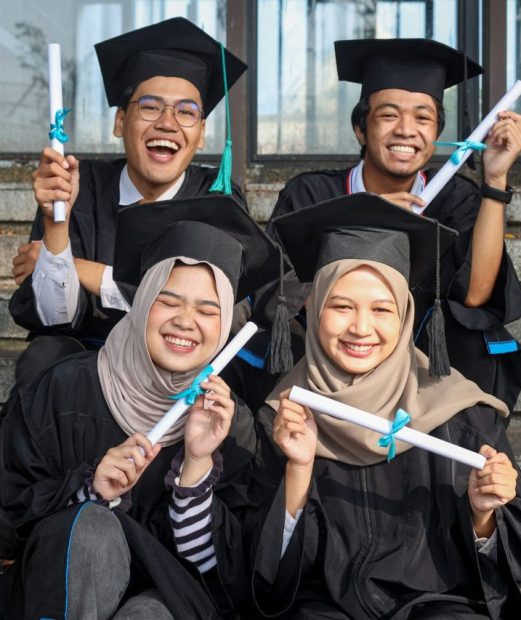 group-of-young-diverse-students-in-graduation-clothes-feeling-excited-showing-diploma.jpg